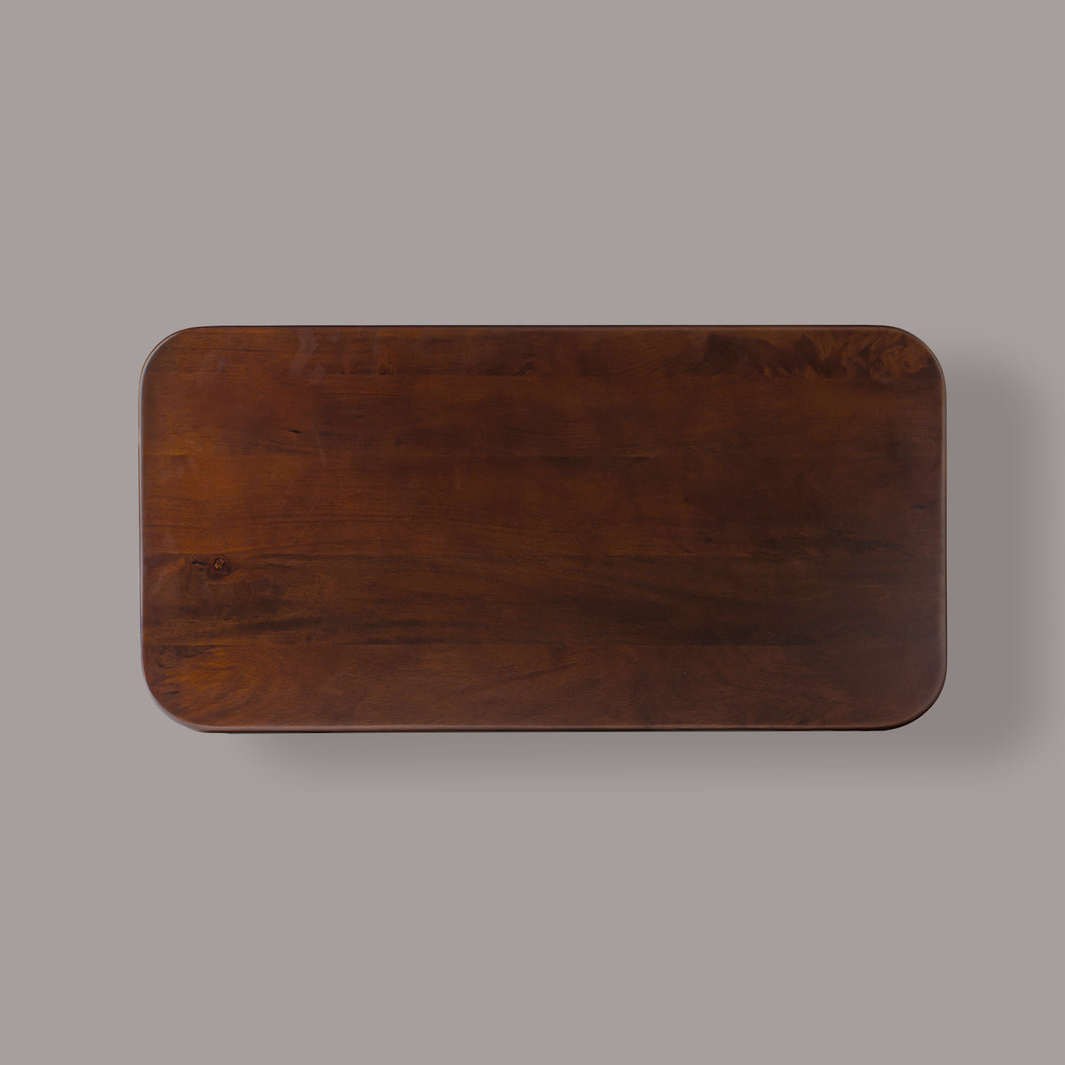 Cinder coffee table from above, showing the rounded corners and mango wood grain