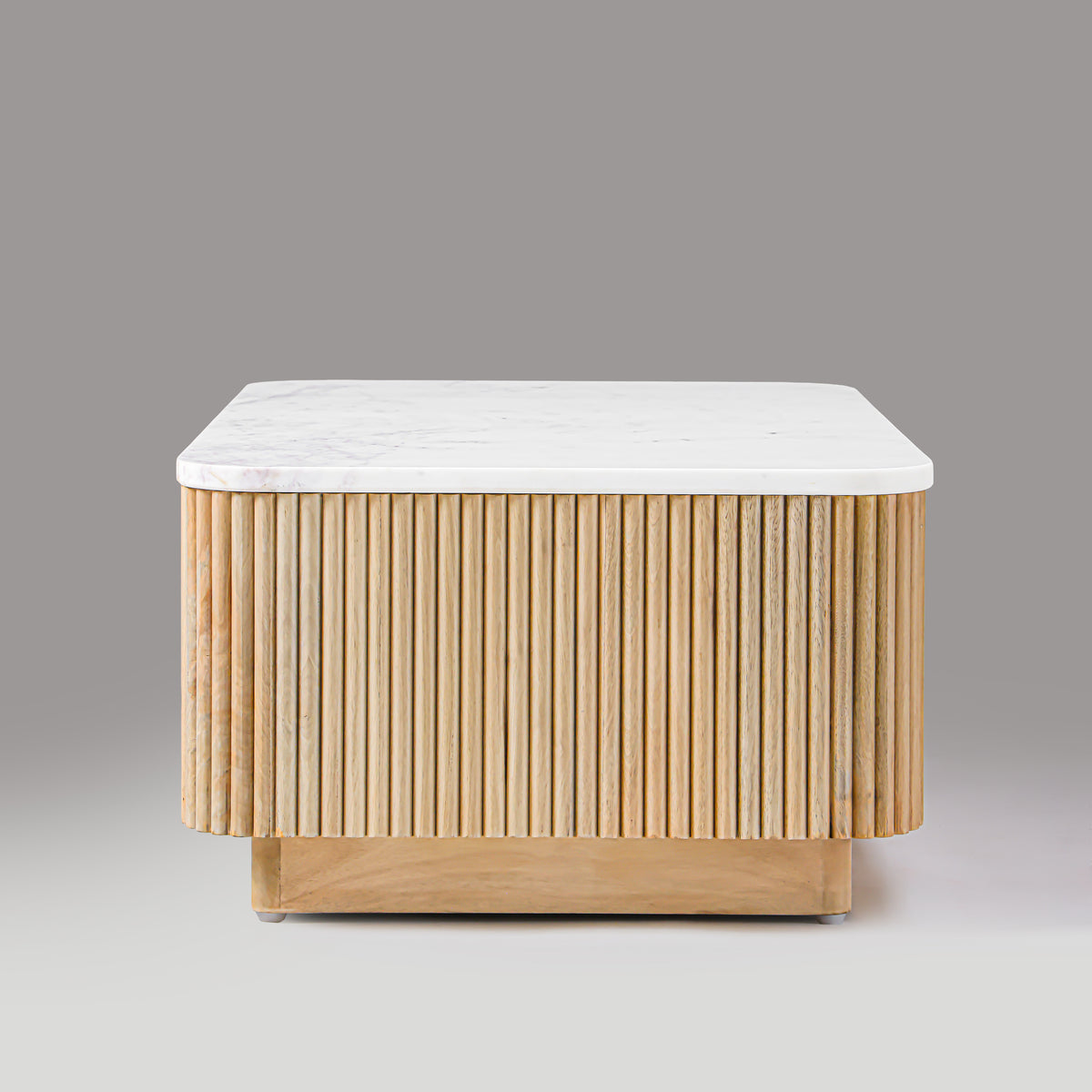 Kelby Blonde coffee table showing hand-finished fluting and rounded corner