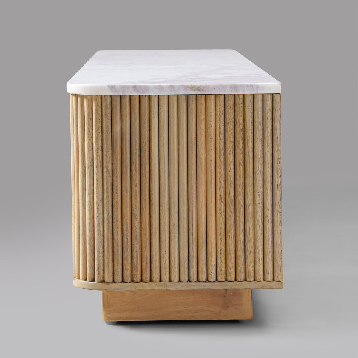 Kelby Blonde TV unit fluting wrapping around the rounded end