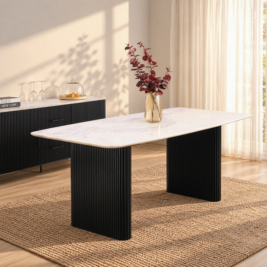 Kelby dining table with natural marble top and black reeded legs