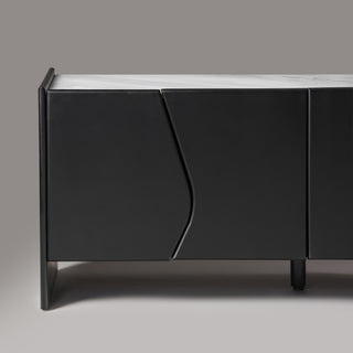 Close-up of wave-cut wood door join on Ares sideboard