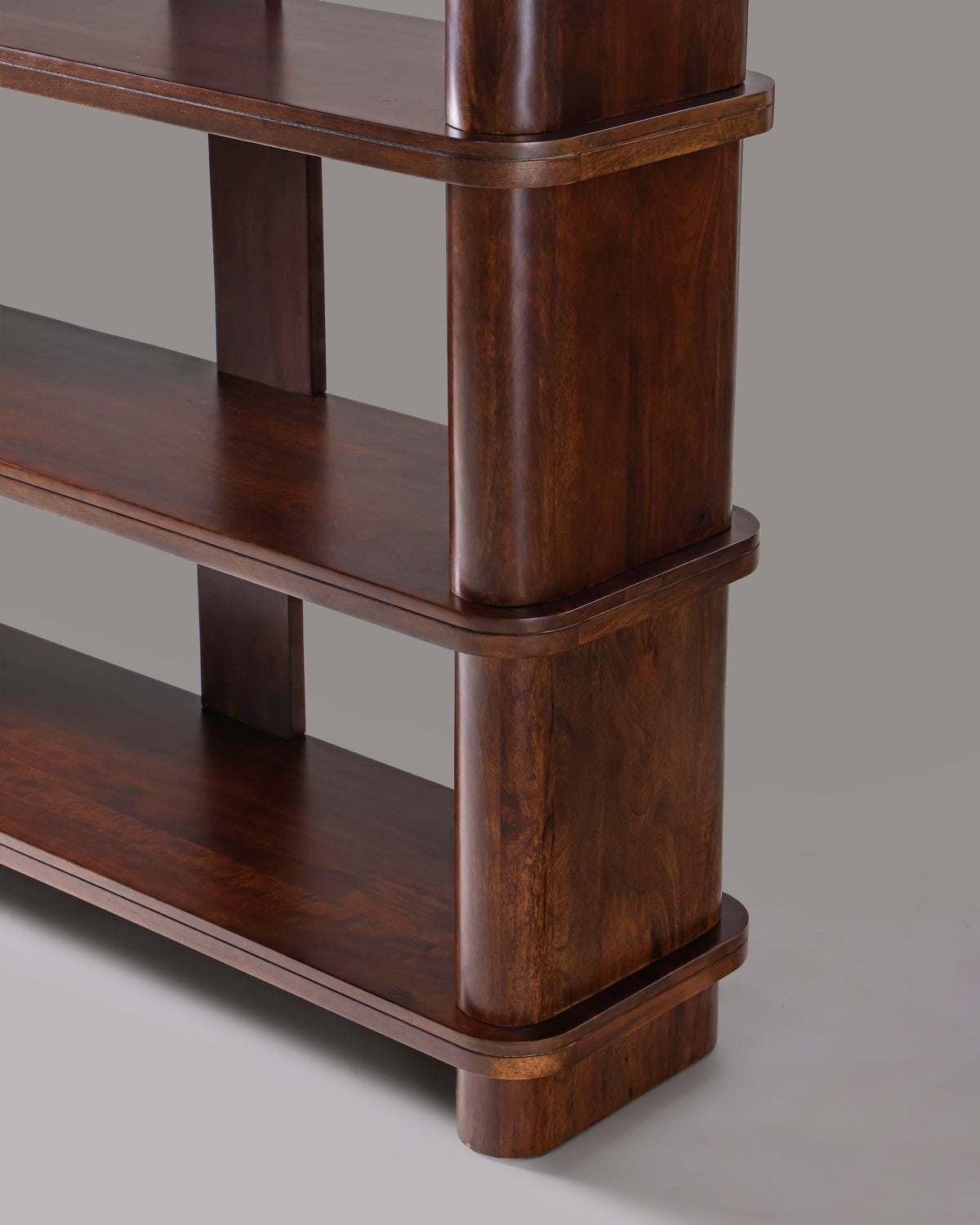 Close-up of Cinder bookshelf shelf with rounded end and stepped edge