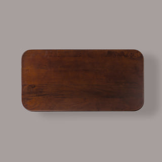 Cinder coffee table from above, showing the rounded corners and mango wood grain