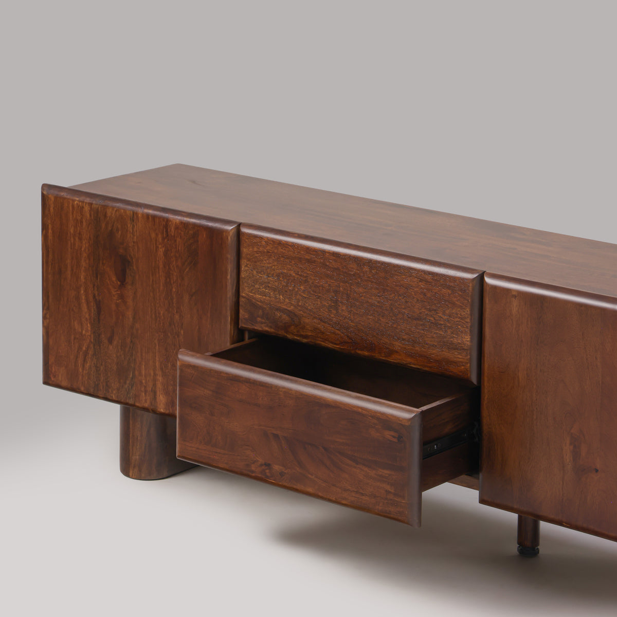 Cinder TV unit with drawer open showing handle-free rounded pull edge