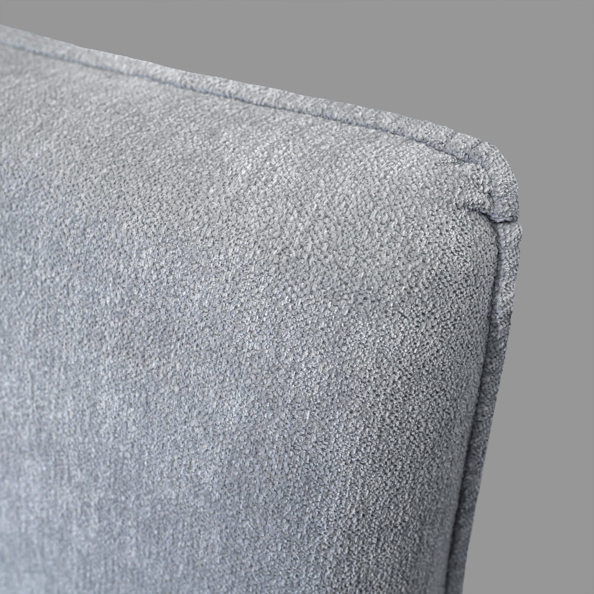 Haze Bed - close-up of headboard corner and piped edge
