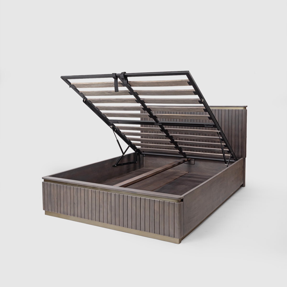 Storage space under the bed with the base lifted open