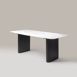 Kelby marble dining table with black legs, angled view