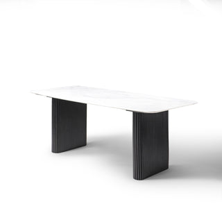Kelby marble dining table with black legs on a white background