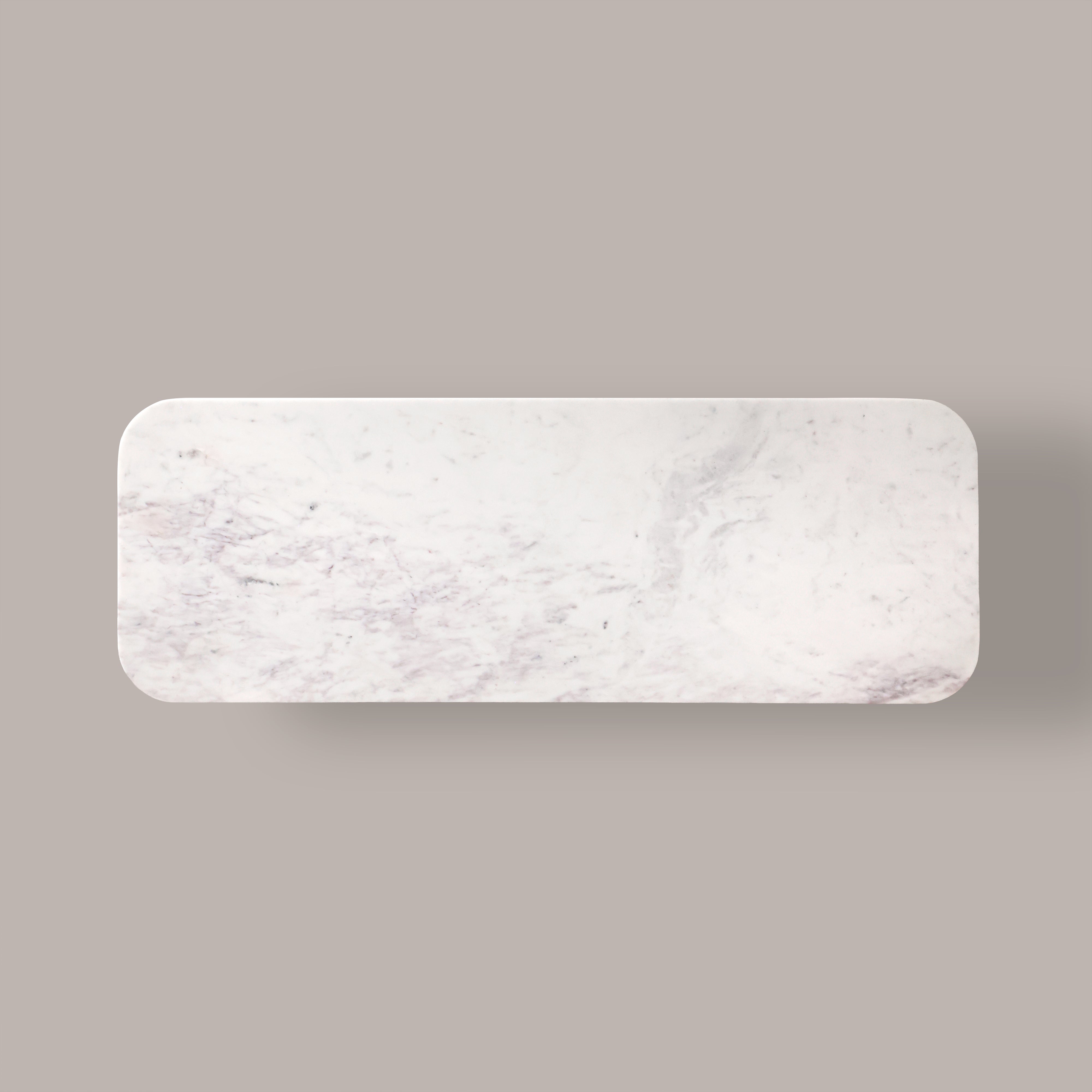 Natural marble top of the Kelby tallboy from above