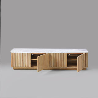 Kelby Blonde TV unit showing hand-finished fluting on the doors