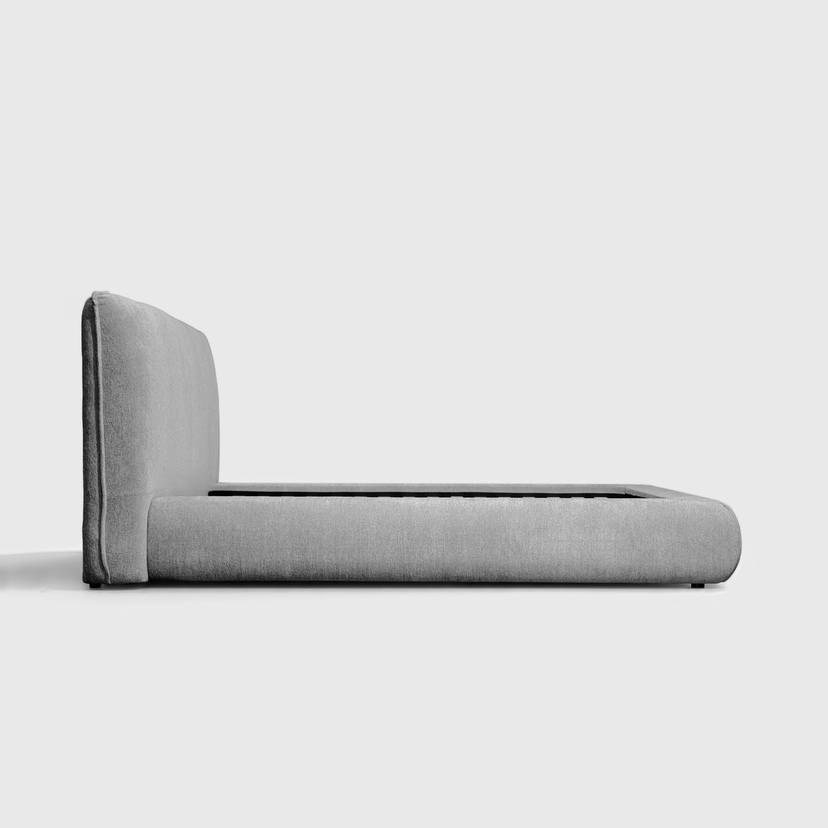 Haze Bed side profile showing headboard height and low rounded frame