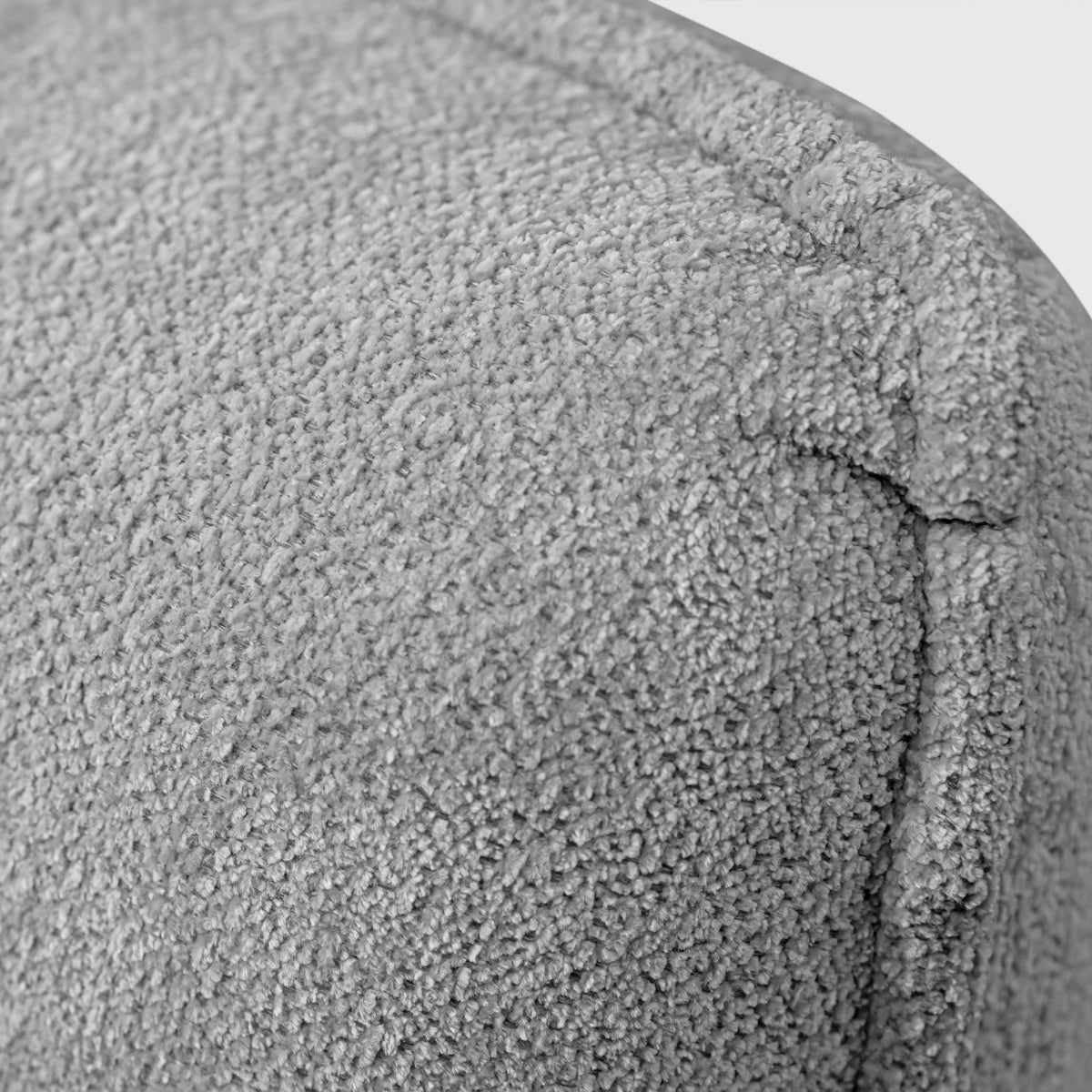 Haze Bed close-up of light grey boucle-style upholstery fabric