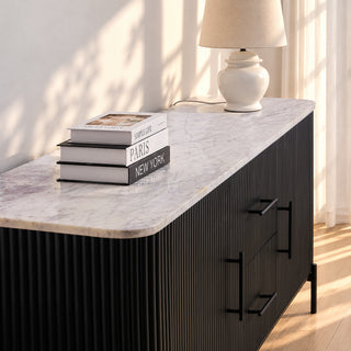 Close-up of the Kelby black buffet marble top, reeded front and metal handles