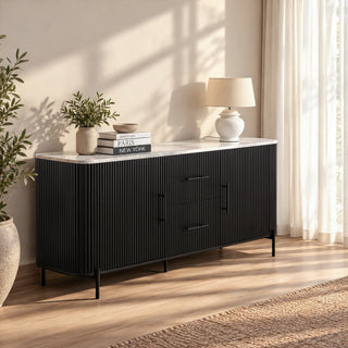 Kelby black buffet with natural marble top, styled in a sunlit room