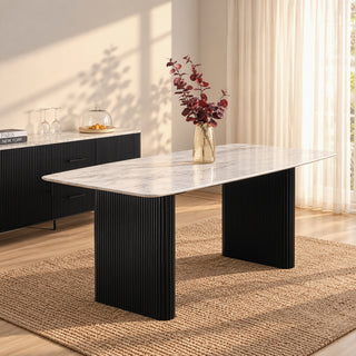 Kelby dining table with natural marble top and black reeded legs