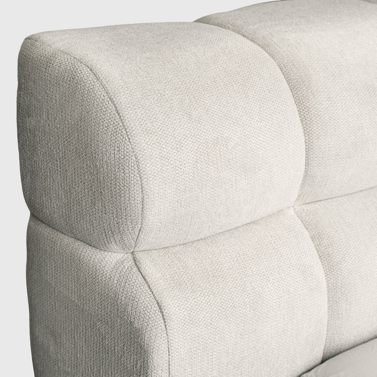 Marshmallow Cloud Bed close-up of tufted ivory headboard